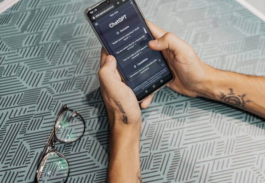 man using smartphone with chat gpt